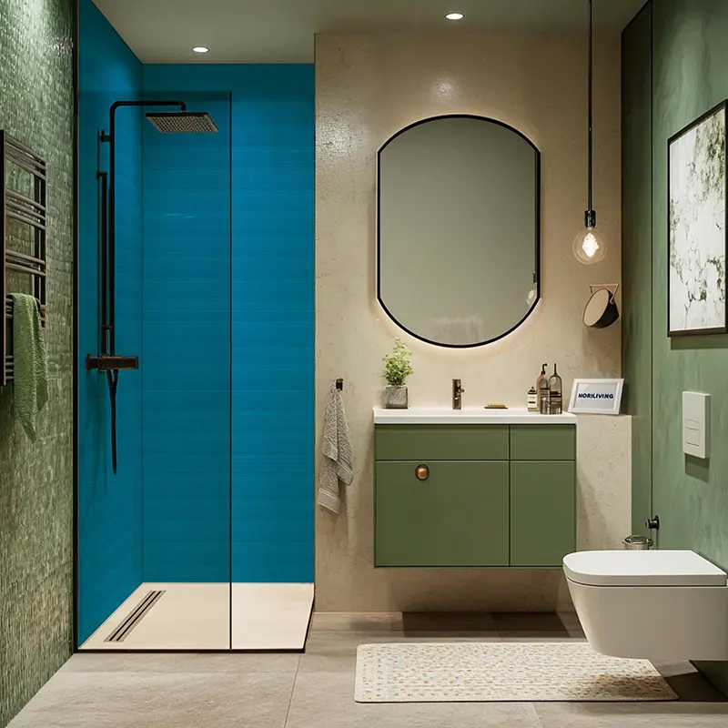 Grünes Waschbecken, runder Spiegel und blauer Duschbereich