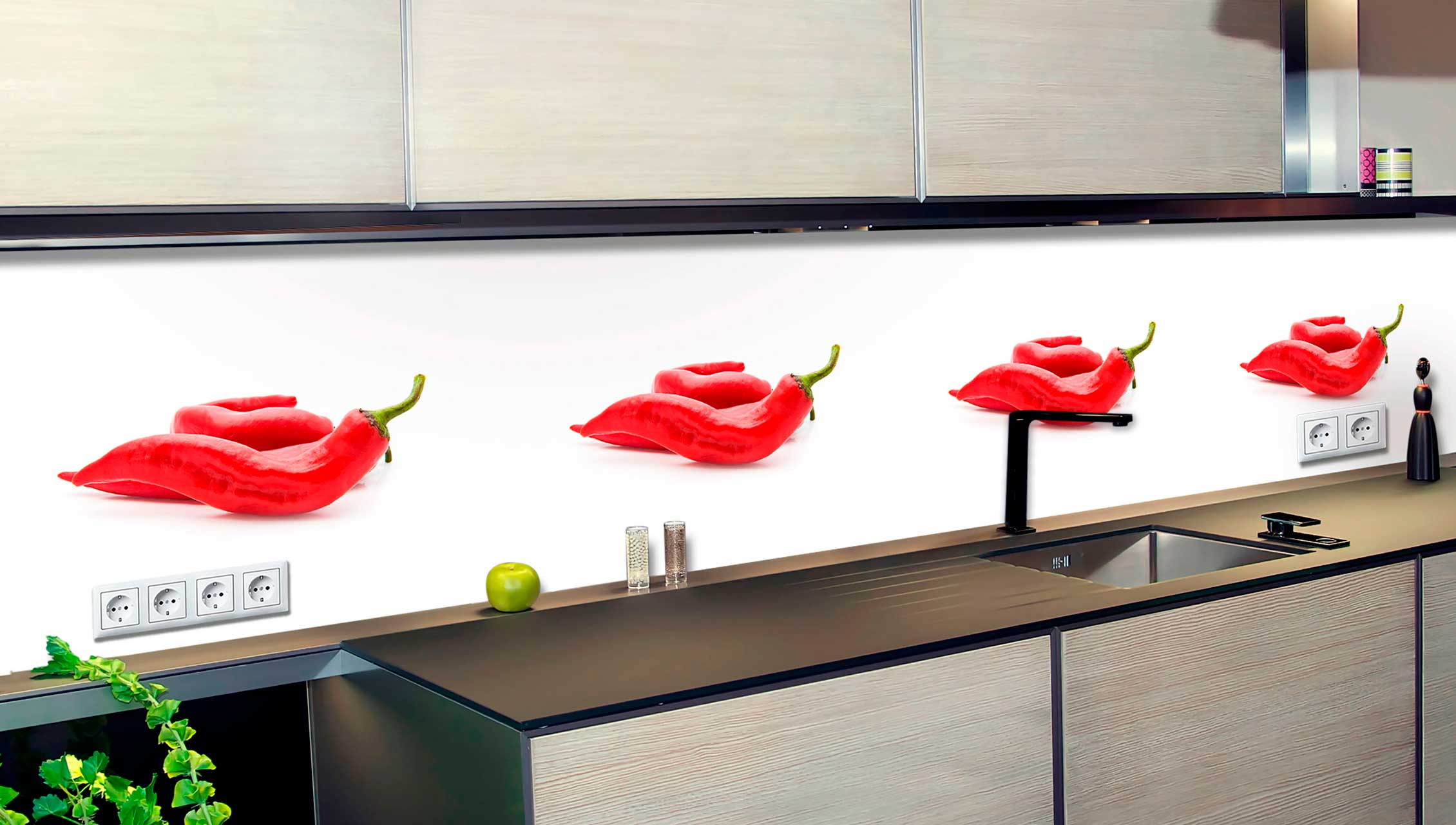 Küche mit moderner Rückwand, bedruckt mit rotem Paprikamuster, über einer schwarzen Spüle